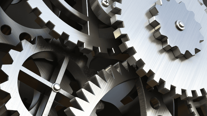 Silver coloured metal cogs close up