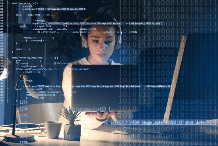 Woman coding on laptop